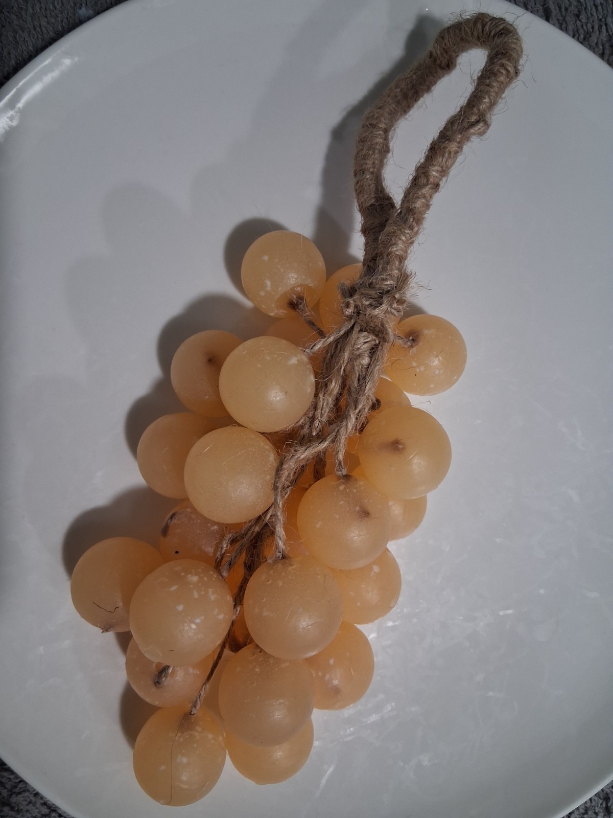 Handcrafted clear glycerin soaps shaped like grape clusters