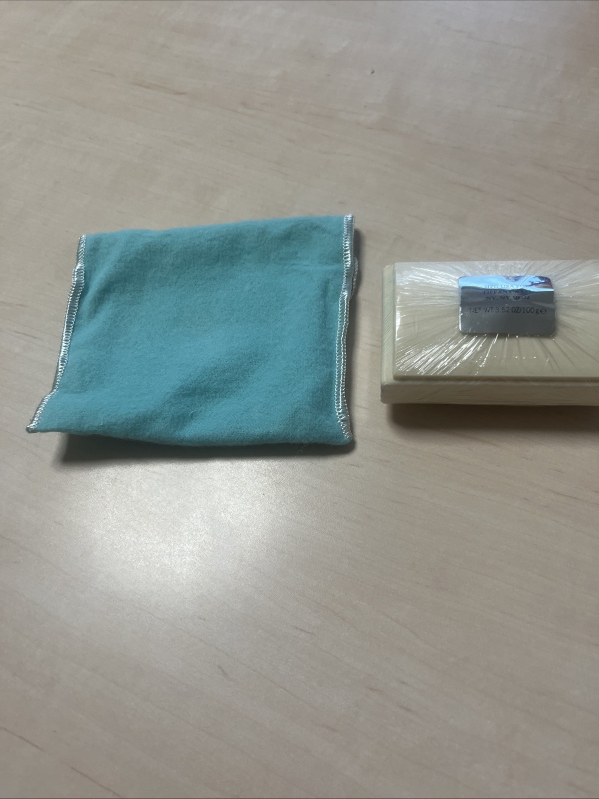 Tiffany & Co. a piece of soap with a dust pouch