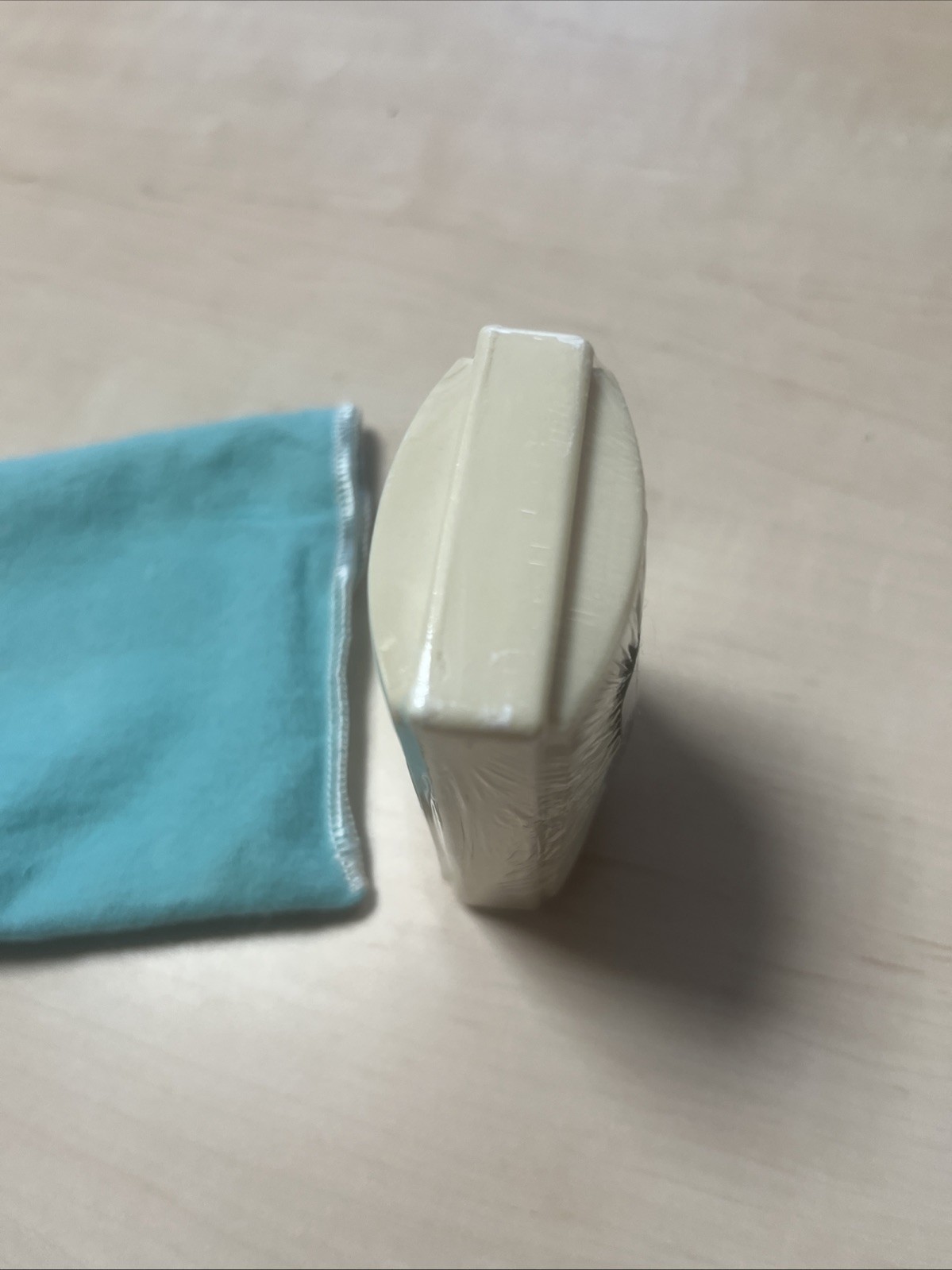 Tiffany & Co. a piece of soap with a dust pouch