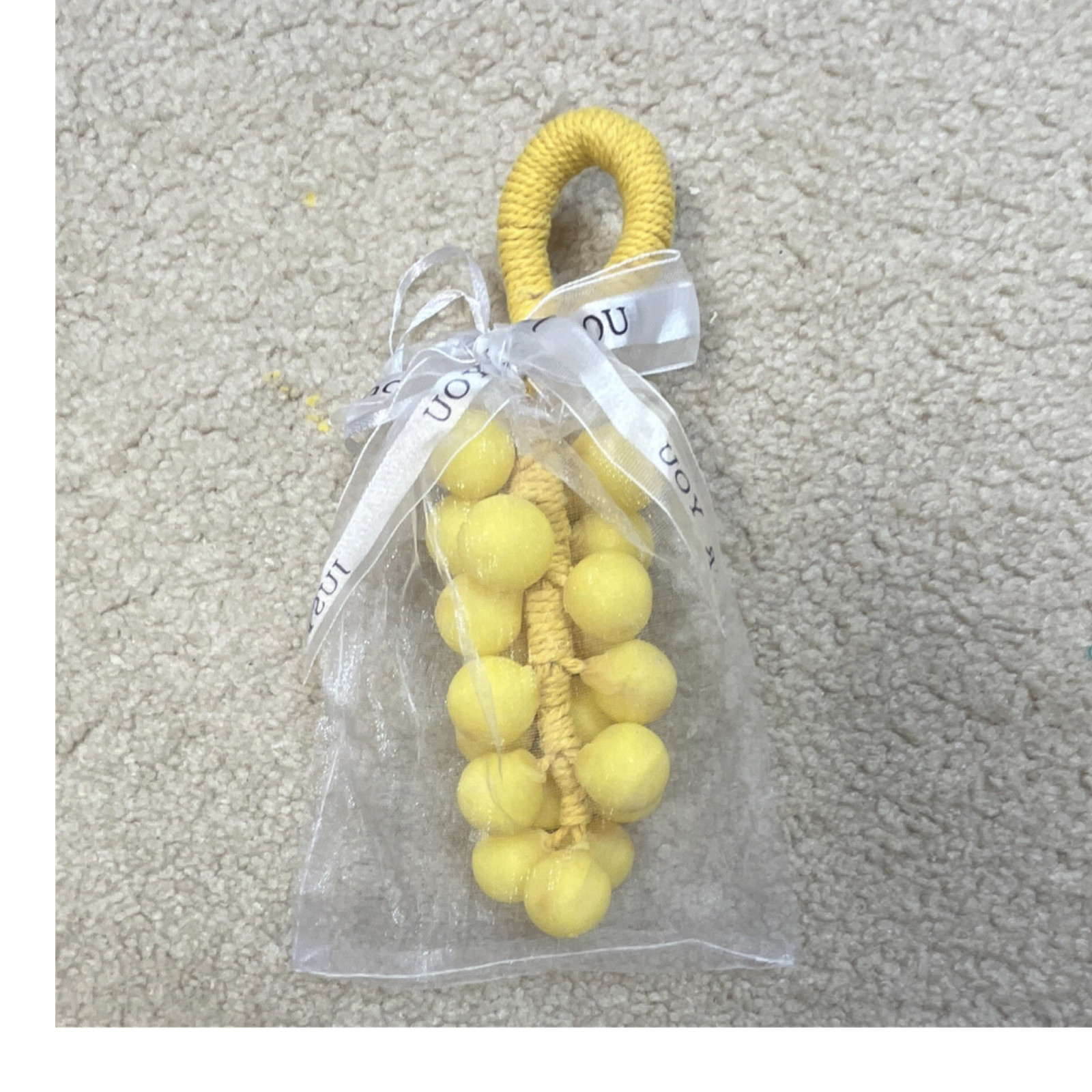 Handmade yellow grape-shaped soap.