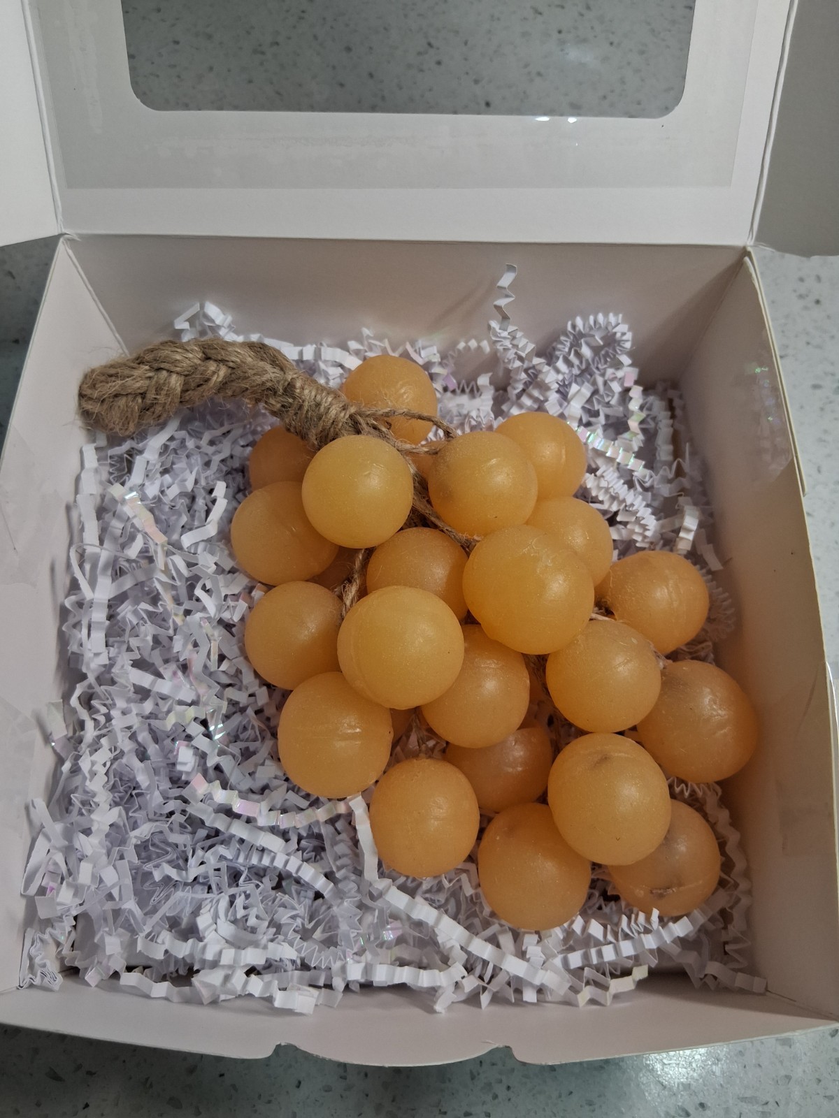 Handcrafted clear glycerin soaps shaped like grape clusters