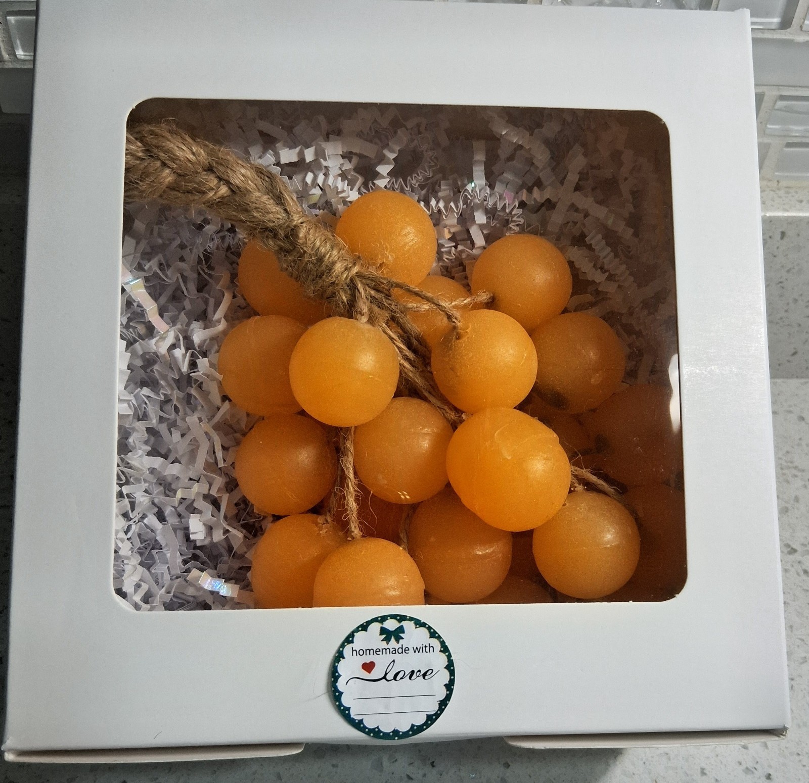 Handcrafted clear glycerin soaps shaped like grape clusters