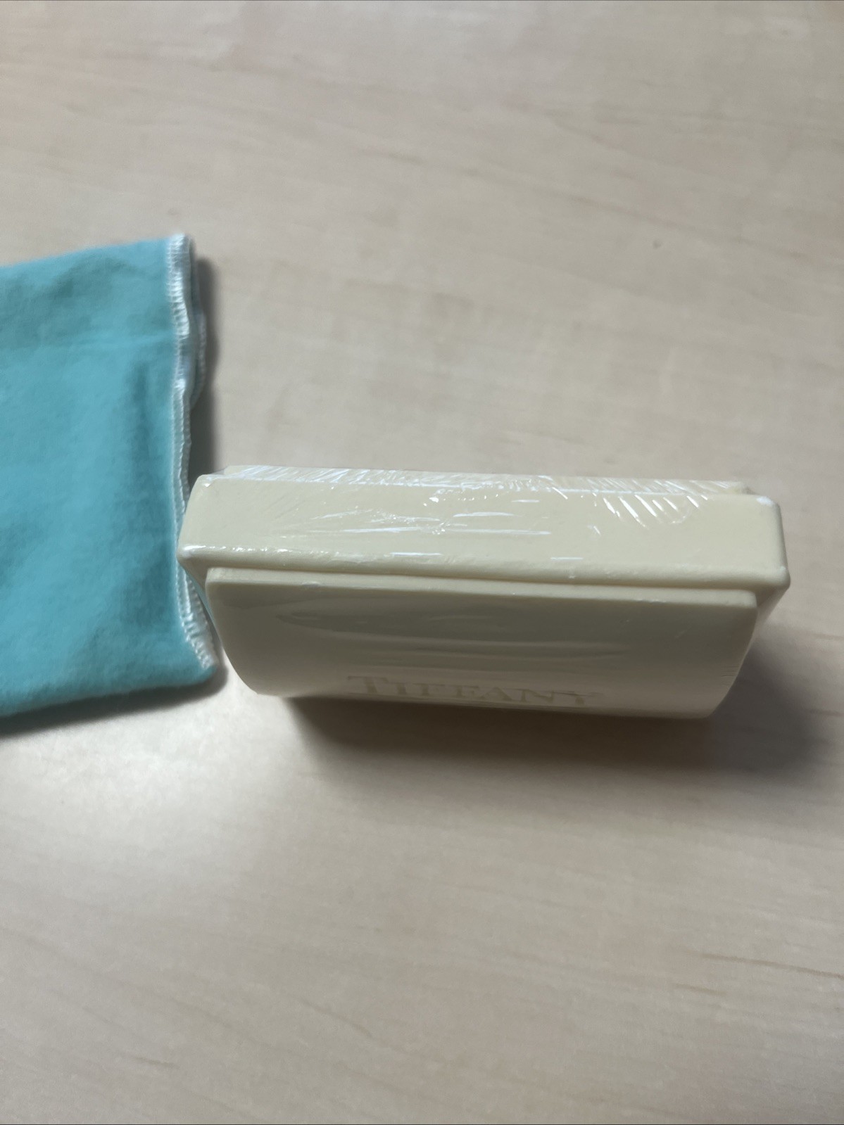 Tiffany & Co. a piece of soap with a dust pouch