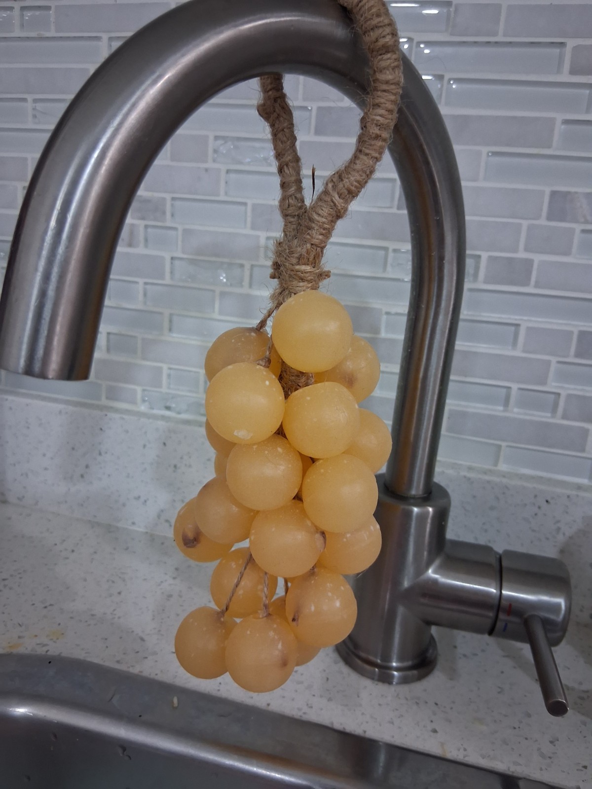 Handcrafted clear glycerin soaps shaped like grape clusters