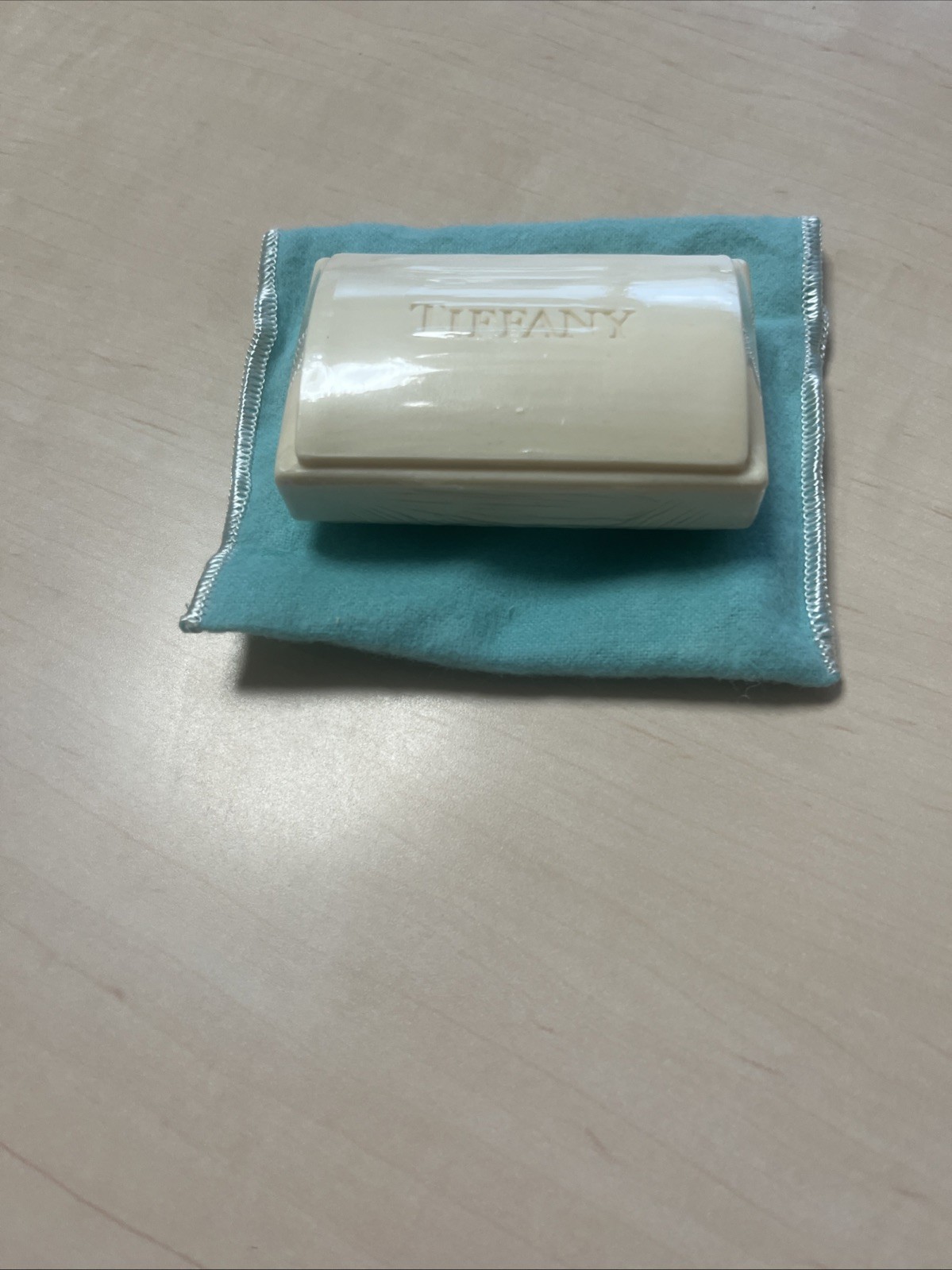 Tiffany & Co. a piece of soap with a dust pouch