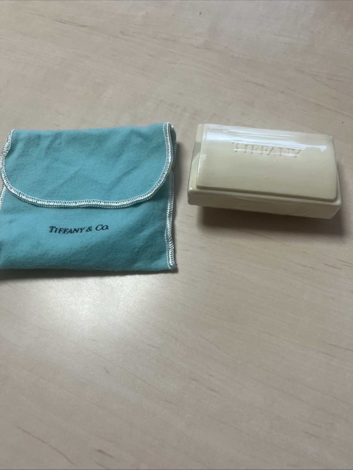 Tiffany & Co. a piece of soap with a dust pouch